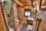 Full adjoining loft bath with tile shower and floors